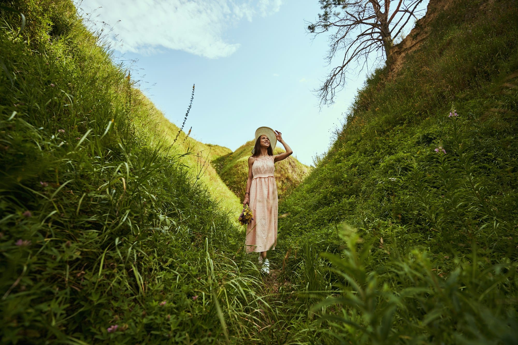 Happy lady enjoying summer walk in the nature