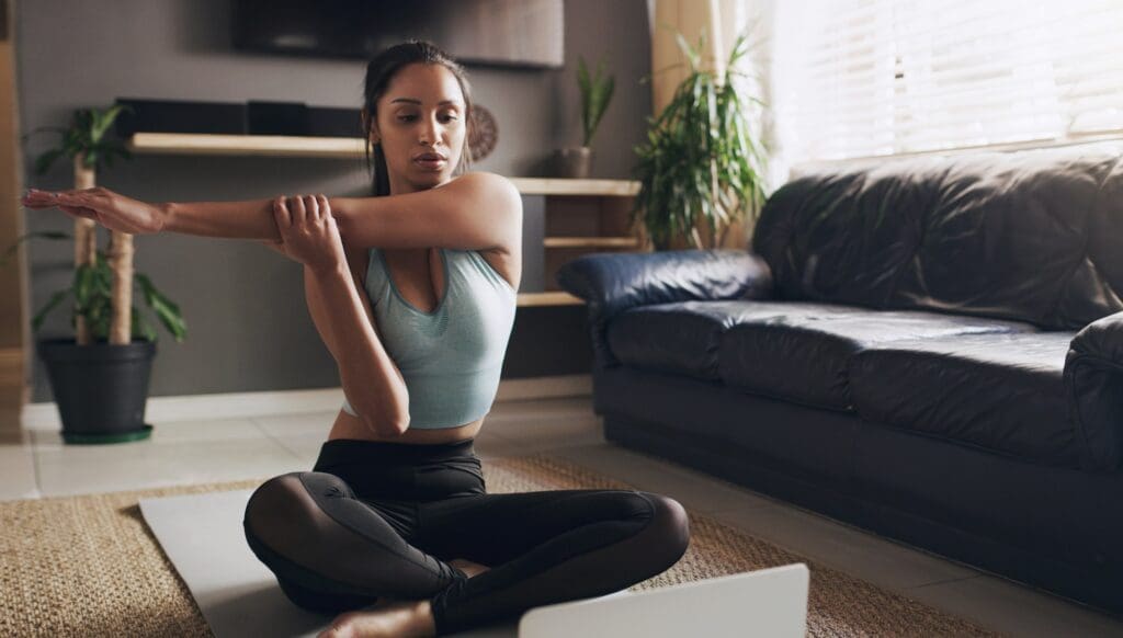 woman stretching at home.