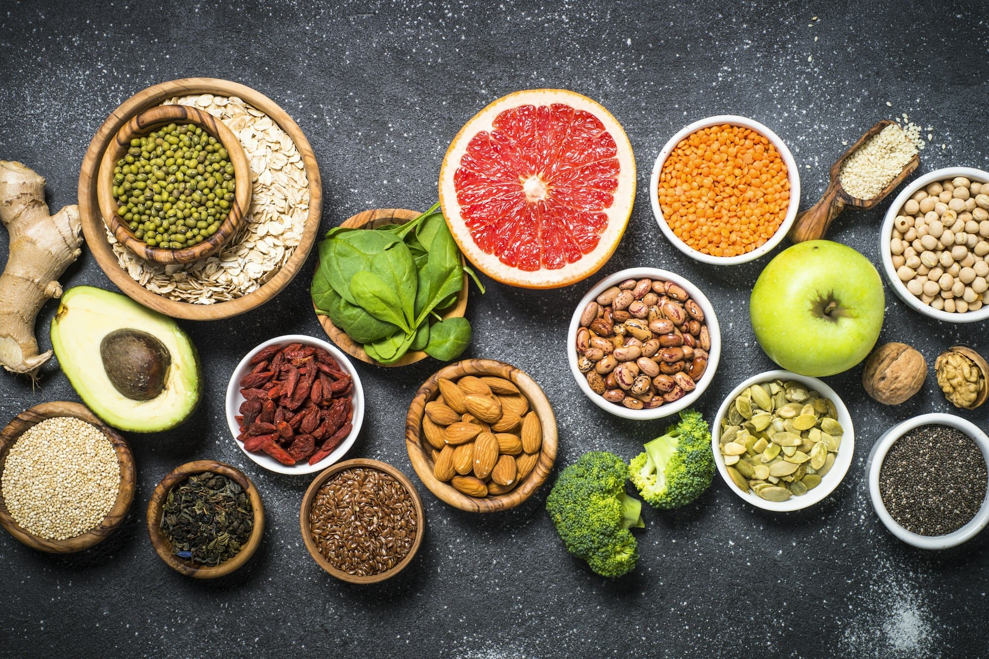 Superfoods on black stone background